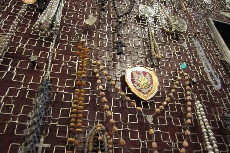 The walls of the church at Jasna Gora are lined with rosaries, coral necklaces and mementos of prayers granted.